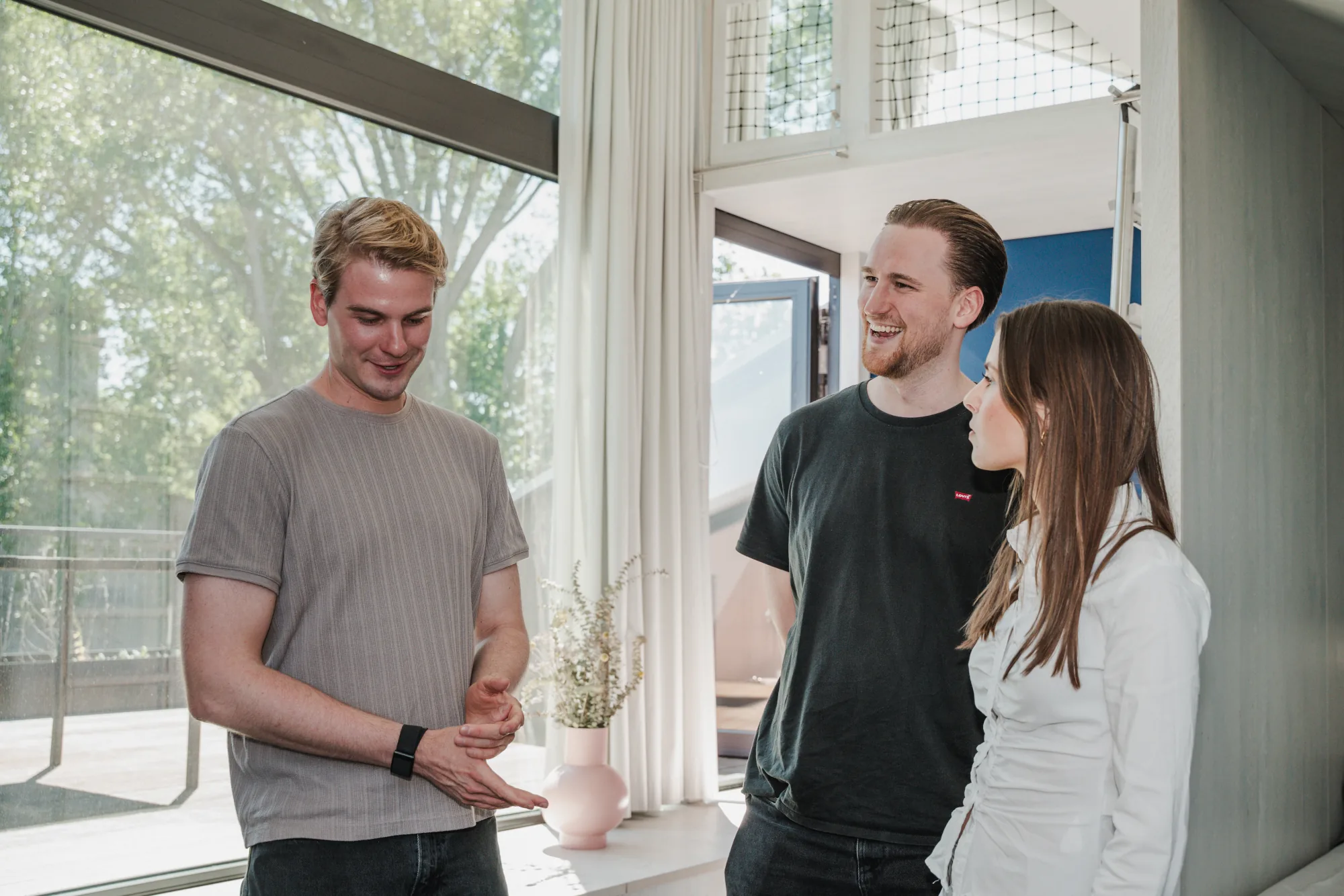 Three Uplane team members in conversation