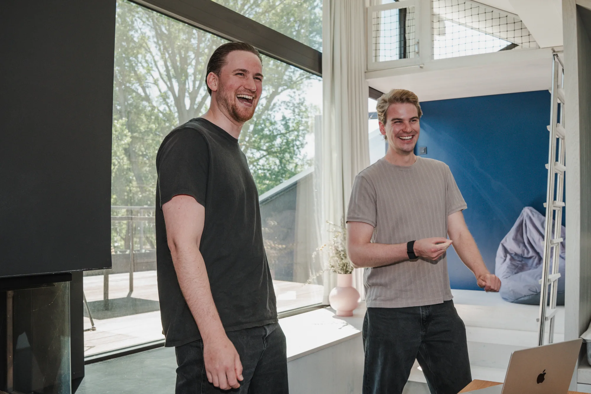 Two Uplane team members laughing together