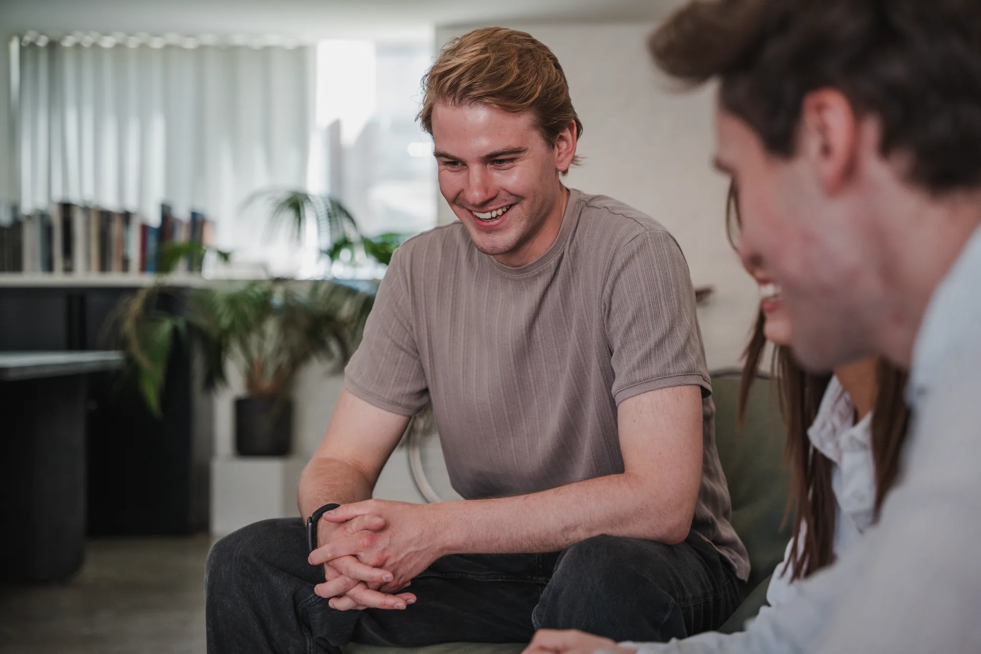 A Uplane team member smiling during a discussion